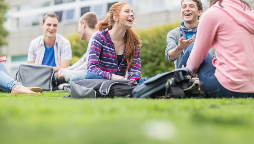 College students sitting on a grass