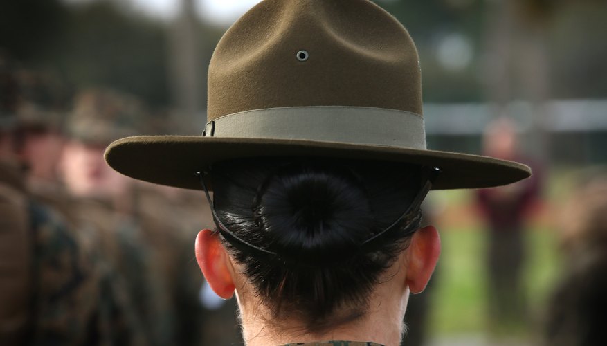 Female Marine Corp Drill Sargent with recruits during boot camp training