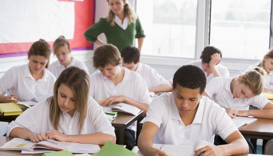 Students taking reading comprehension test in classroom