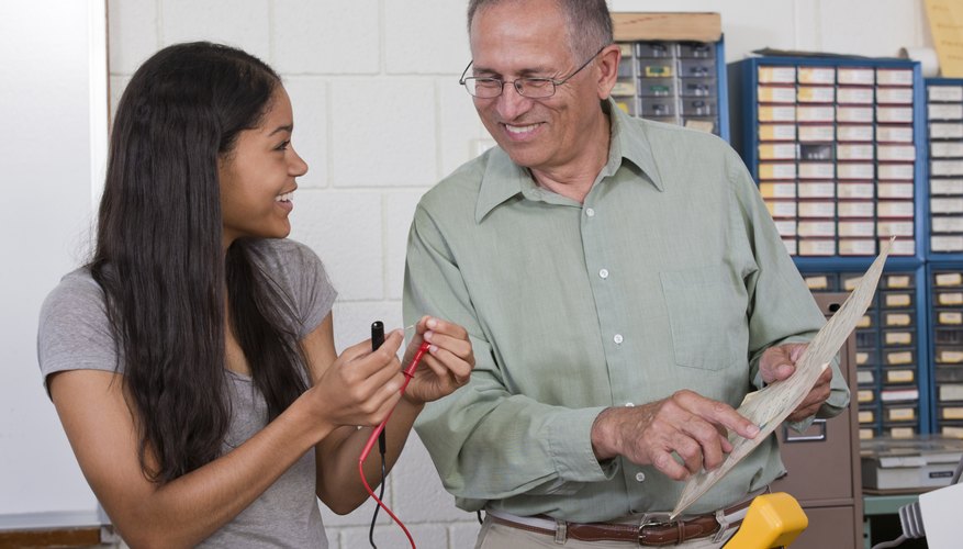 Smiling young student working at internship