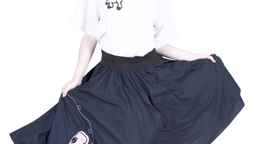 Poodle skirts, white button-up blouses and scarves, worn together or separate, are all items appropriate for a sock-hop event.