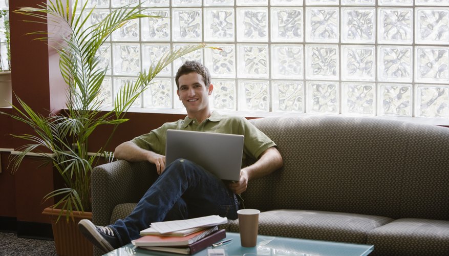 Young man working on laptop.