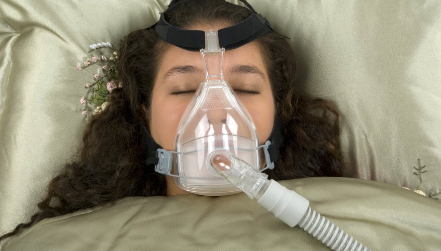 Image of a woman wearing a CPAP machine.