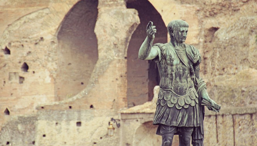 A statue of Augustus Caesar outside of an ancient building in Rome.