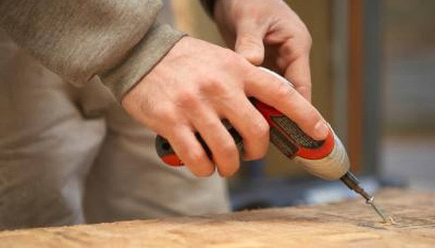 A small drill can help turn a ceramic tile into a clock.