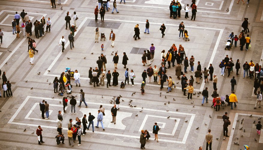 An elevated view of people walking in a plaza.