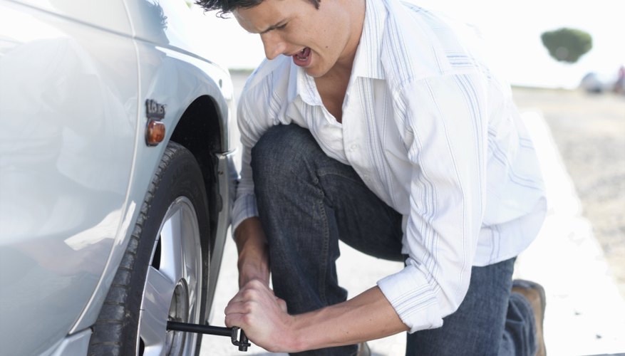 Man changing flat tire