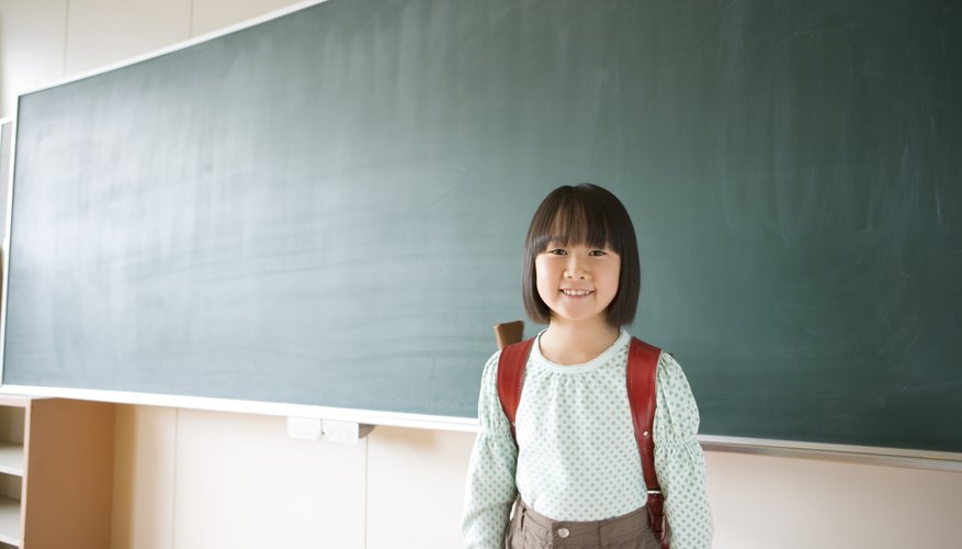 Smiling young child in classroom.