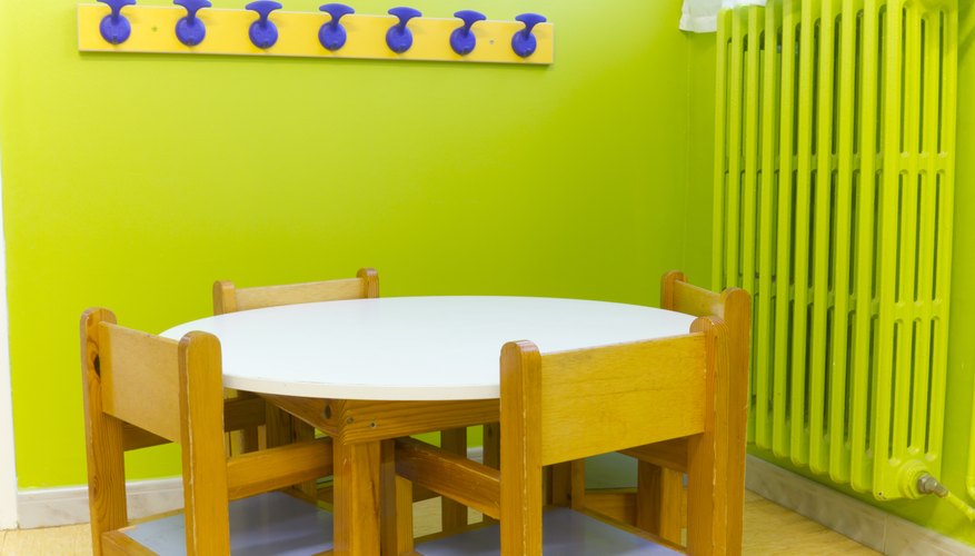 A small seating area near coat hooks in a child's classroom.