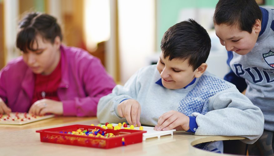 Disabled students learning in classroom.