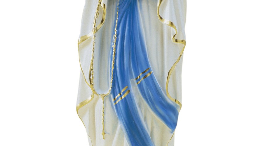 Catholics demonstrate their devotion to Mary, represented here, in the rosary.