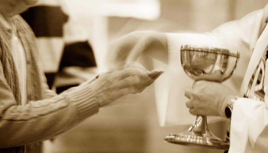 Priest handing out a communion wafer