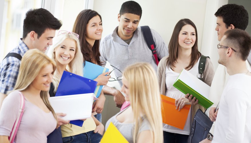 Image of college students talking in the hall.