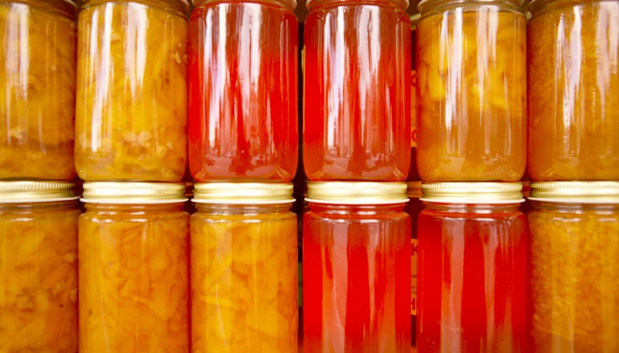 Canning your own goods saves money and builds up storage.
