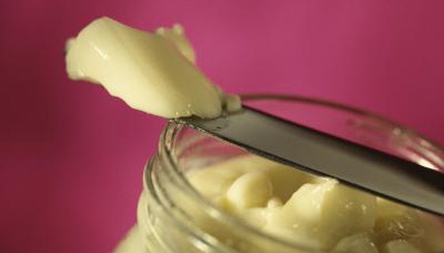 Don't allow crumbs or other bits of food to enter your mayo by a knife -- they will spoil it.