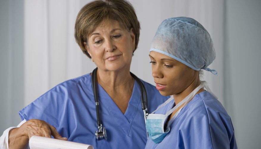 A nurse is chatting with a doctor.