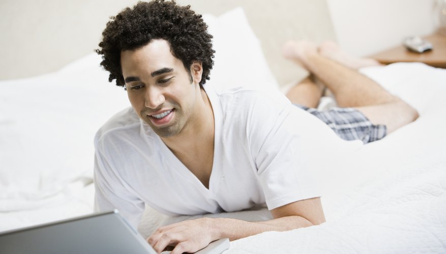 Man working on laptop at home