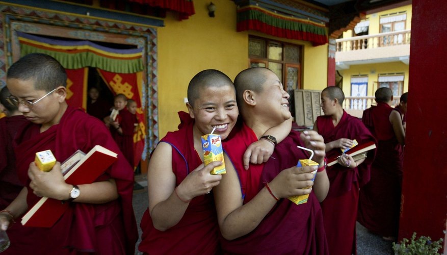 Buddhist nuns take a break after a prayer session.
