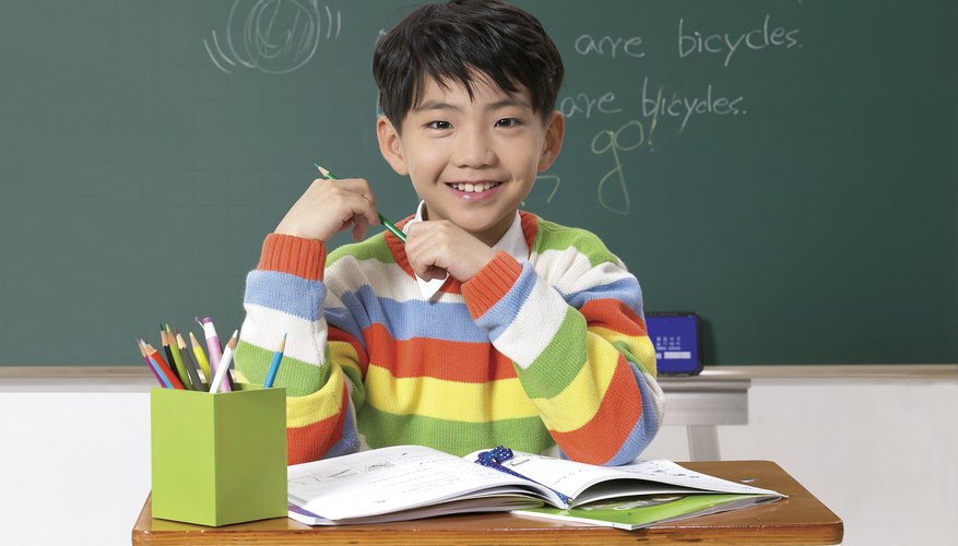 child with personalized pencils