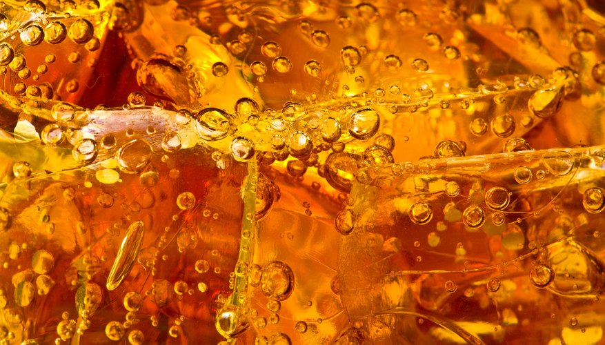 Bubbles and ice in cola.