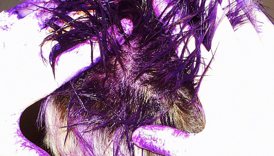 Hot water, baking soda and shampoo are the staples to removing semi-permanent hair dye.