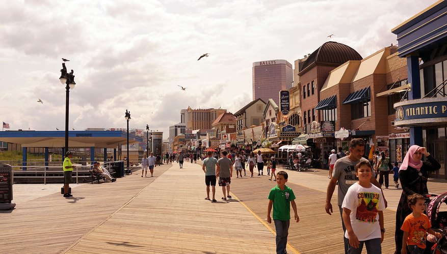 Tourists walk along the boardwalk in Atlantic City, New Jersey.