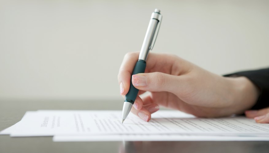 Young woman writing a paper.