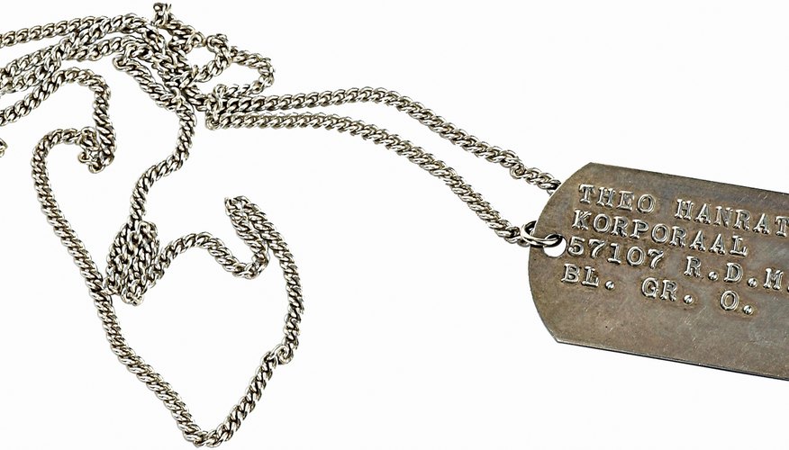 Dog tags list a soldier's name, social security number and blood type.