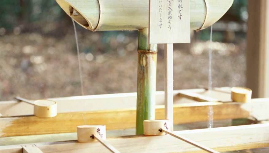 Water is made available at the entrance to Shinto shrines for visitors to wash their hands and mouths.