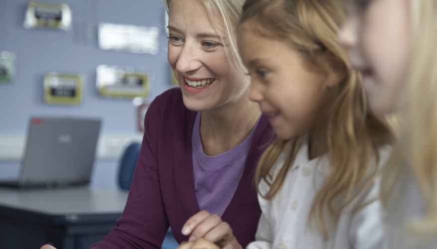 Substitute teacher talking to students in classroom.