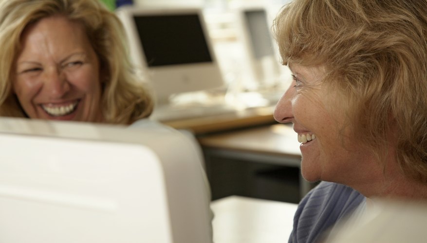 Two adult women are in a class together.