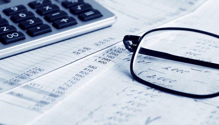Close-up of accounting paperwork and glasses
