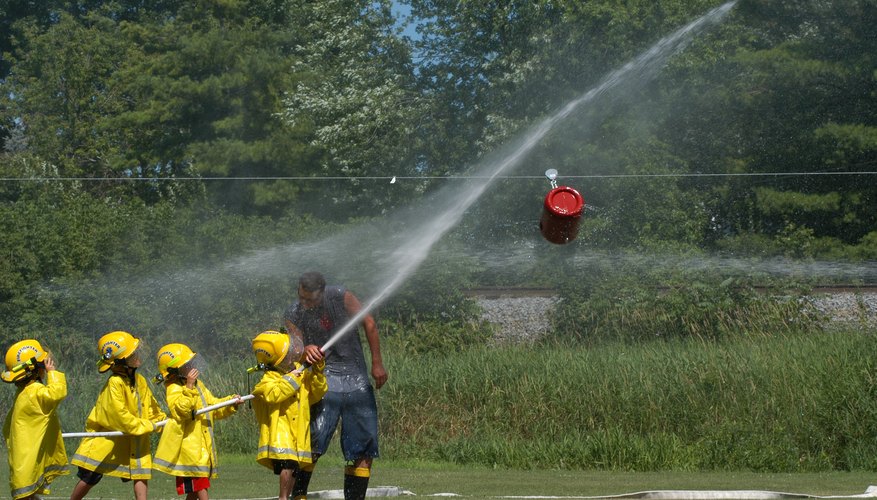 Young children are learning how to be firefighters.