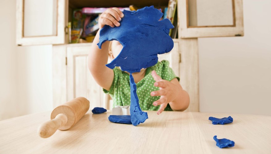 Learning about form through clay keeps young children busy and involved.