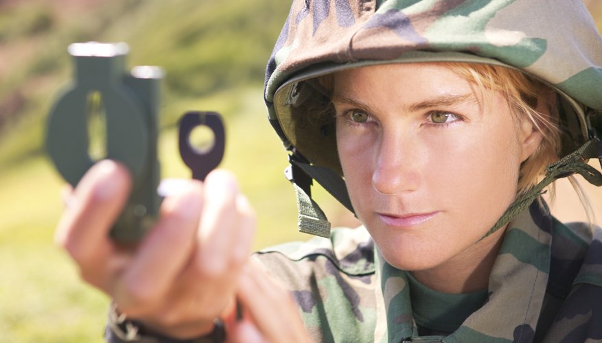 Soldier taking compass reading