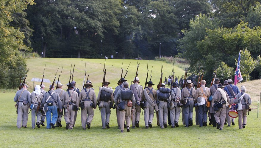 Recreation of civil war soldiers marching with bayonets.