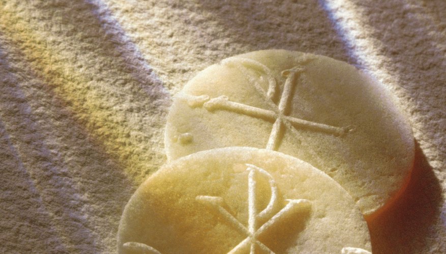 The bread used in the Eucharist is typically in the form of flat, embossed wafers called hosts.