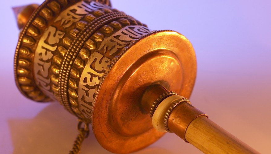 This small Tibetan prayer wheel has the words of a prayer embossed on its surface.