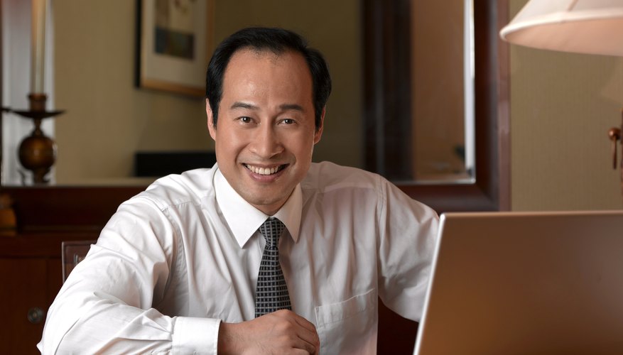 Chinese businessman with laptop.