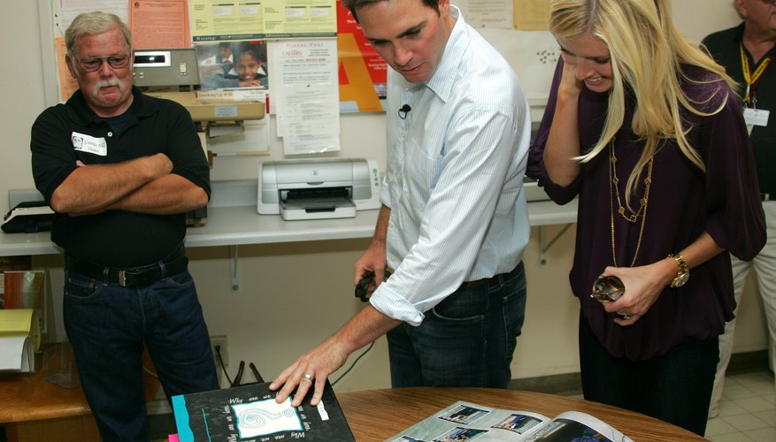NASCAR champion Jimmie Johnson and his wife checked out his photo in the 1993 Granite Hills high yearbook during a school visit in 2010.