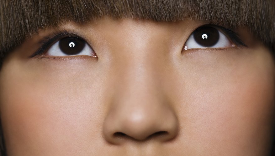 Soften the look of your bangs by smoothing them with heat.