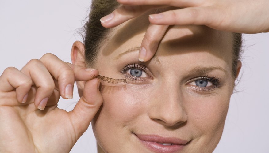 Look in the mirror while removing false eyelashes.