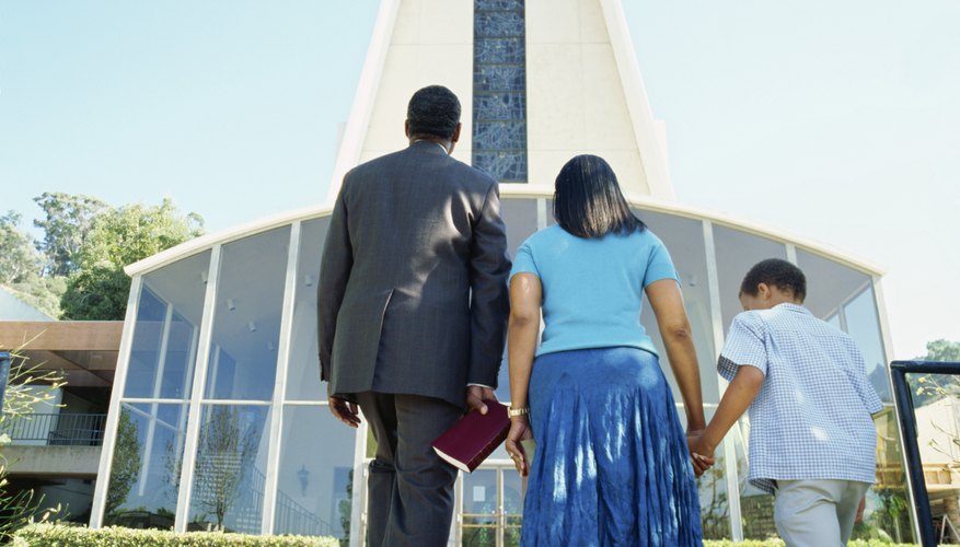 Ushers sometimes welcome members as they enter the church.