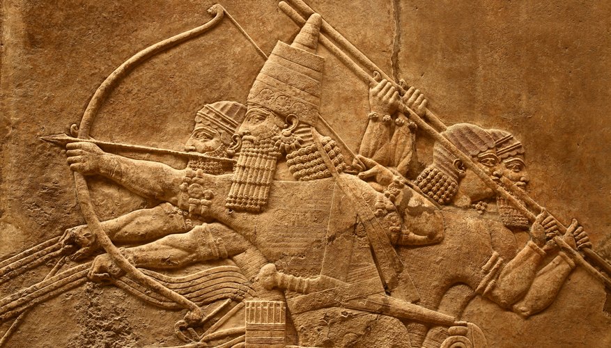 A relief sculpture of ancient Assyrian art depicting battle.