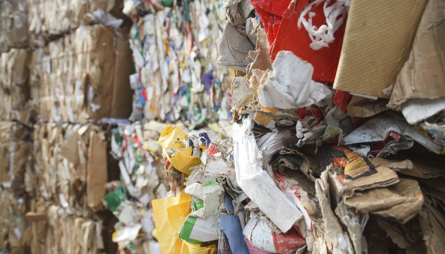 Bundles of used paper is prepared for recycling at the recycling center.