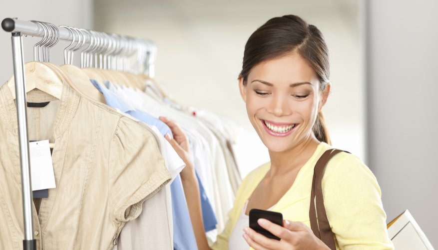woman smiling while she reads text