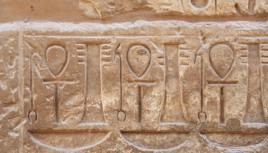 Stone tablet with ankh symbols carved into it
