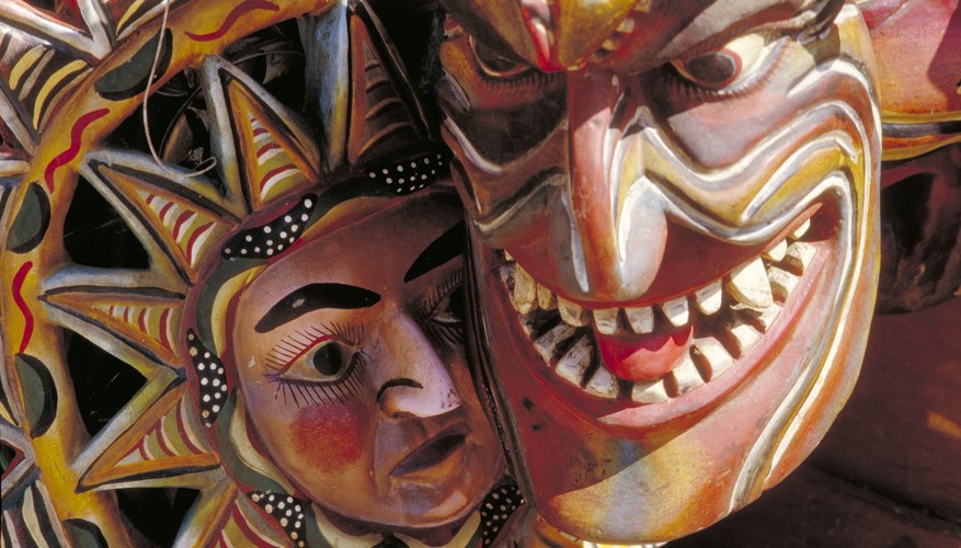 A close-up of two Mexican masks.
