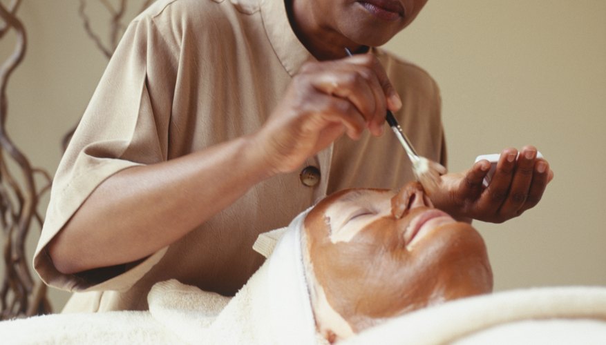 During a facial, an esthetician applies products picked out especially for your skin.
