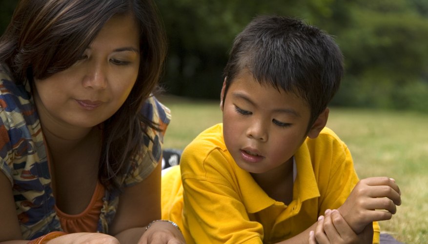 One-on-one reading time with a teacher or parent helps support a young child's reading progress.